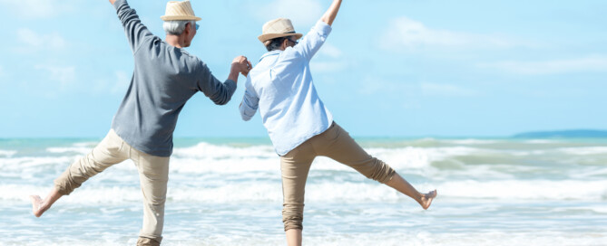 Happy elderly couple on the beach